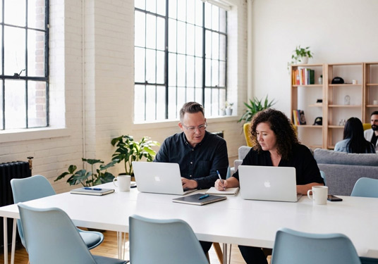 Jessica-and-Tyler-working-on-a-Local-SEO-Client-Marketing