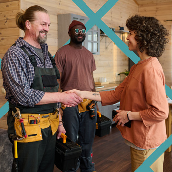 Happy-Homeowner-with-Local-Service-Business Happy homeowner shaking hands with home service contractors after a completed job