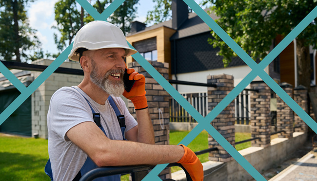 Happy local service business owner talking on the phone while receiving a 5-star review outside a residential home