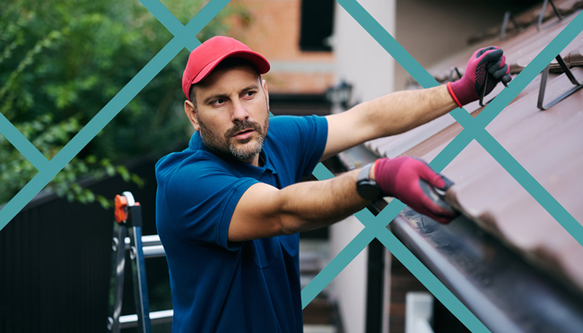 Gutter installer working on a residential home roofline